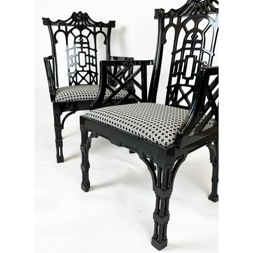 538 - OPEN ARMCHAIRS, a pair, 61cm x 106cm H, Chinese pagoda style, black gloss, Spanish 1960's. (2)