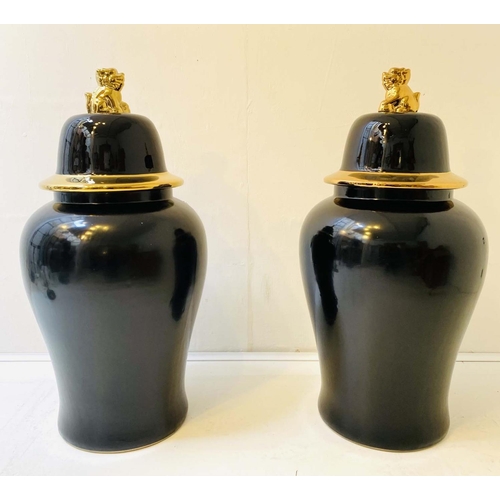 520 - CHINESE TEMPLE URNS, a pair, glazed ceramic with a black and gilt finish, 82x39x39. (2)