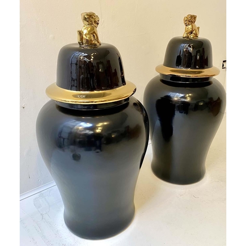 520 - CHINESE TEMPLE URNS, a pair, glazed ceramic with a black and gilt finish, 82x39x39. (2)