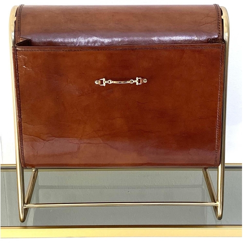 534 - MAGAZINE RACK, 38cm high, 39cm wide, 20cm deep, tanned leather and a gilt metal frame.