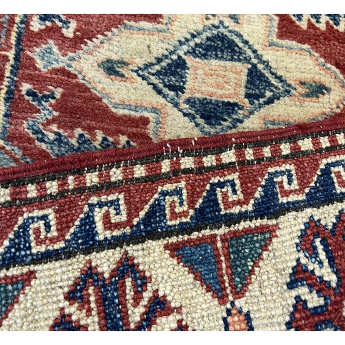 108 - KAZAK RUNNER, 310cm x 86cm.