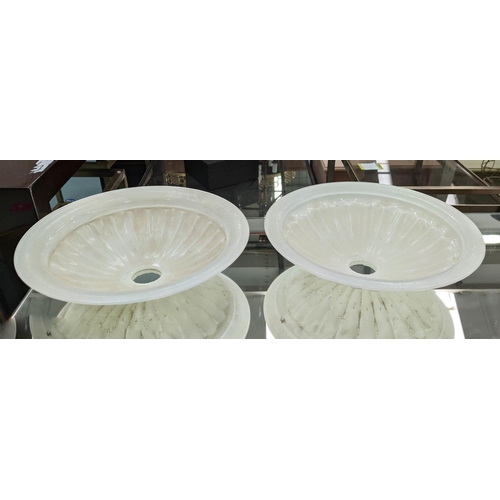 575 - BELLA FIGURA TORCHERES, a set of four, each 70cm H with glass dish shades and fluted distressed wood... 