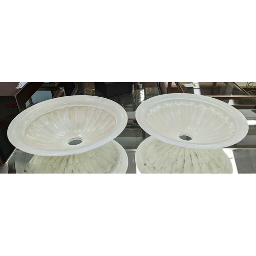 576 - BELLA FIGURA TORCHERES, a set of four, each 70cm H with glass dish shades and fluted distressed wood... 