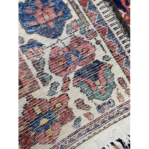 99 - ANTIQUE BAKTIARI CARPET, 310cm x 220cm.