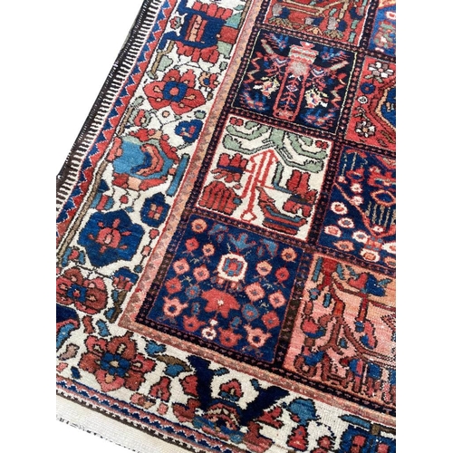 99 - ANTIQUE BAKTIARI CARPET, 310cm x 220cm.