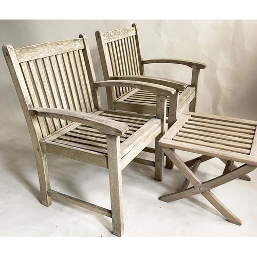 159 - GARDEN ARMCHAIRS, a pair, nicely weathered slatted teak with curved arms and a low X frame table by ... 