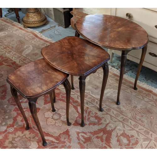 206 - NEST OF THREE TABLES, largest 53cm x 41cm, 20th century walnut the shaped oval tops on slender suppo... 