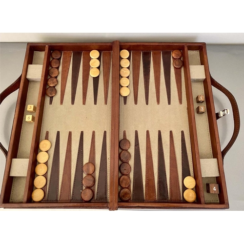 491 - BACKGAMMON SET, leathered case, 7cm x 23cm x 40cm, contemporary.