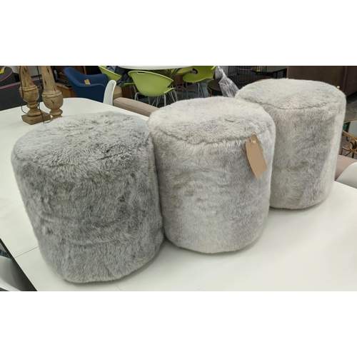 620 - FAUX FUR STOOLS, three, each 44cm W x 51cm H, cylindrical. (3)