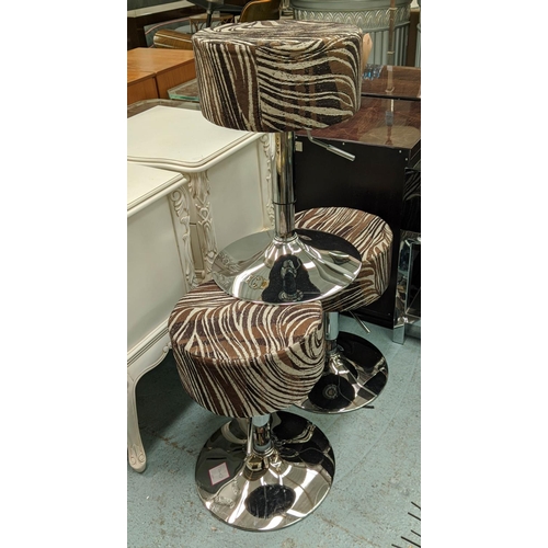 621 - STOOLS, a set of three, each 35cm W c 57cm H, zebra striped fabric. (3)