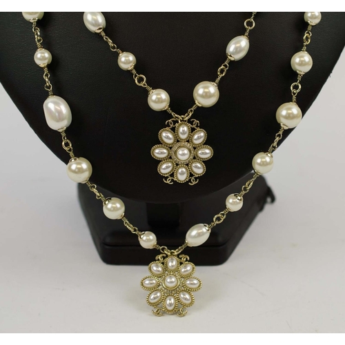 8 - CHANEL NECKLACE, faux pearl and gold tone, with flower head pendants, linking together forming a two... 