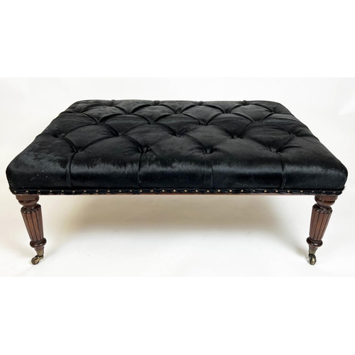 580 - FOOTSTOOL, 125cm x 48cm H x 95cm, buttoned cowhide on reeded supports.