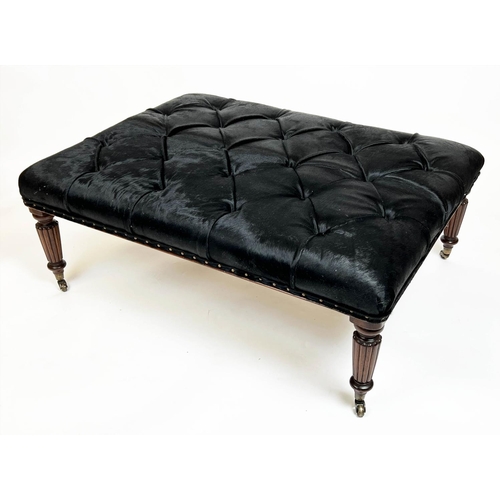 580 - FOOTSTOOL, 125cm x 48cm H x 95cm, buttoned cowhide on reeded supports.