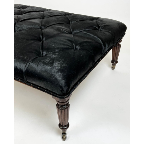 580 - FOOTSTOOL, 125cm x 48cm H x 95cm, buttoned cowhide on reeded supports.