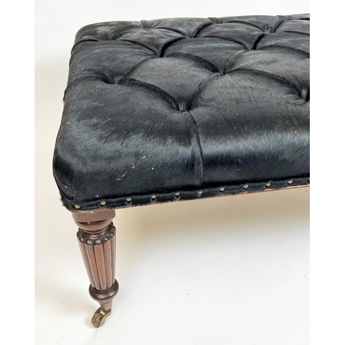 580 - FOOTSTOOL, 125cm x 48cm H x 95cm, buttoned cowhide on reeded supports.