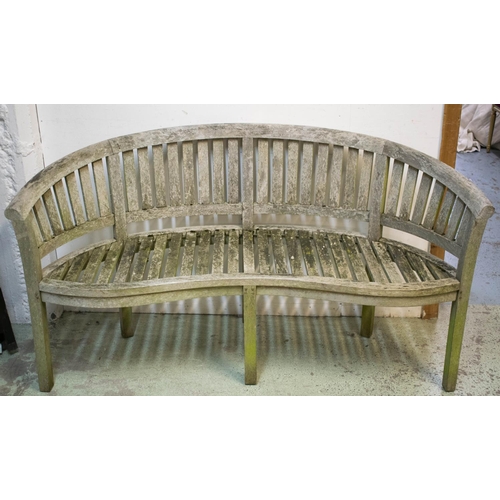 582 - GARDEN BENCH, 86cm H x 156cm teak, banana shaped.