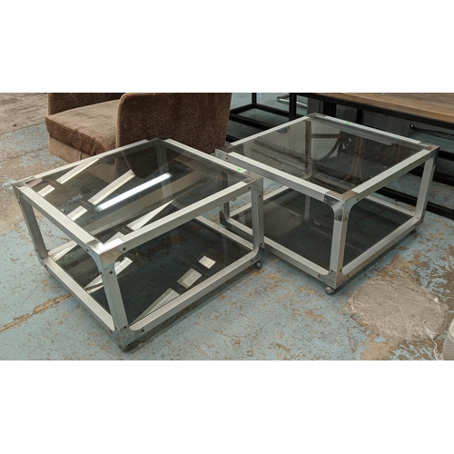 590 - SIDE TABLES, a pair, 64cm x 64cm x 41cm, Italian style cube design, smoked glass tiers, on castors. ... 