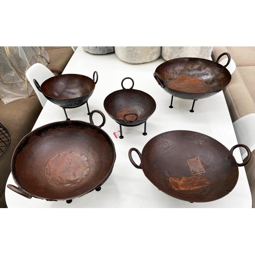 487 - INDIAN KADAI FIRE BOWLS ON STANDS, a set of five, 46cm diam. at largest, of various sizes. (5)