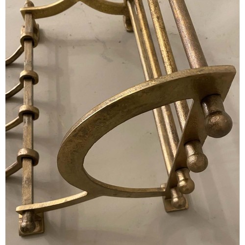 650 - WALL MOUNTING LUGGAGE RACKS, a pair, gilt metal, 35cm x 46cm x 26cm. (2)