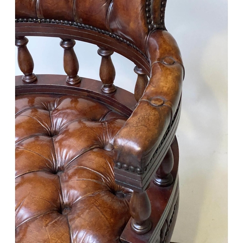 658 - REVOLVING DESK CHAIR, vintage buttoned tan leather, revolving and reclining on a base with castors.