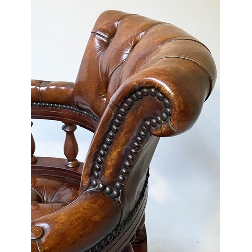 658 - REVOLVING DESK CHAIR, vintage buttoned tan leather, revolving and reclining on a base with castors.