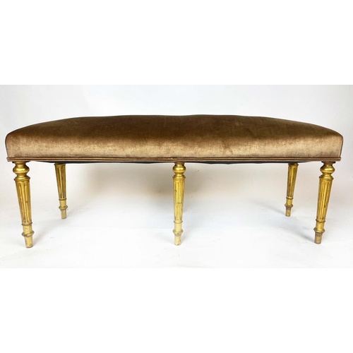 198 - WINDOW SEAT, Regency style giltwood, upholstered in gold fabric, on turned legs, 124cm H x 39cm x 43... 