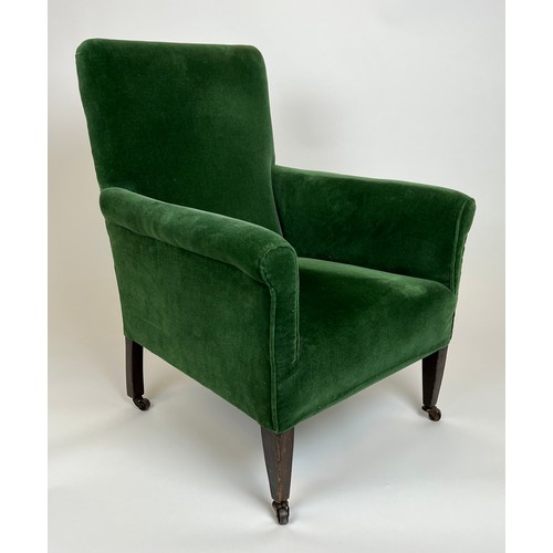 126 - EDWARDIAN ARMCHAIR, green velvet upholstered raised on tapered legs and castors, stamped M.F. Co Ltd... 