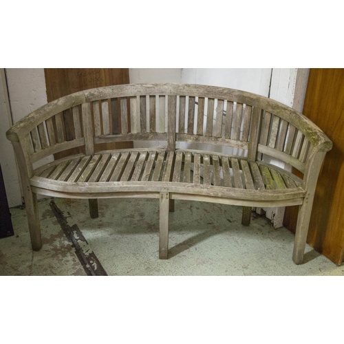 349 - GARDEN BENCH, 85cm H x 160cm, weathered teak of banana form.