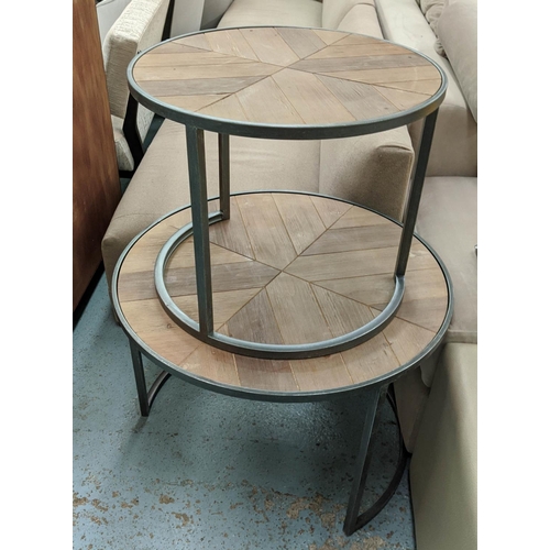 402 - NEST OF TABLES, a graduated pair, parquetry style tops, 75cm diam x 55cm. (2)