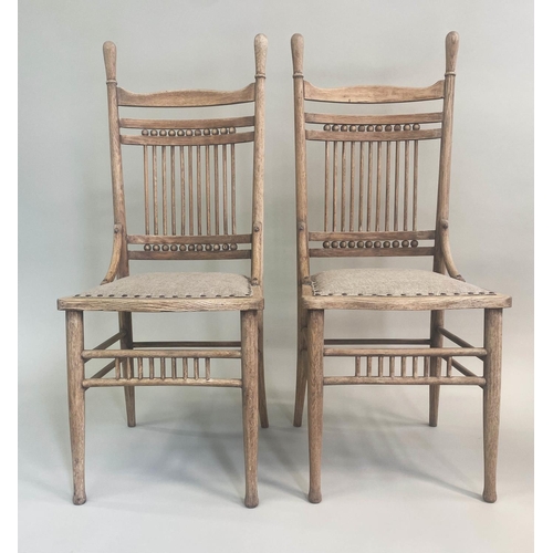 207 - SIDE CHAIRS, a pair 19th century oak with American  spindle back and studded linen upholstery. (2)