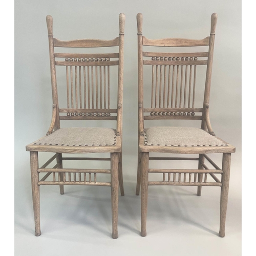 207 - SIDE CHAIRS, a pair 19th century oak with American  spindle back and studded linen upholstery. (2)