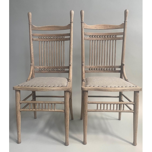 207 - SIDE CHAIRS, a pair 19th century oak with American  spindle back and studded linen upholstery. (2)