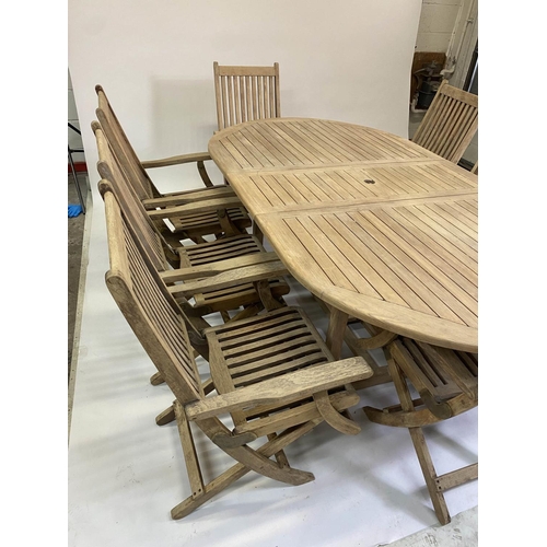 206 - GARDEN TABLE AND CHAIRS, weathered teak rounded rectangular slatted 75cm H x 119cm x 210cm L with ei... 