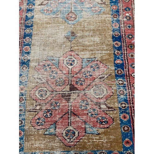 106 - ANTIQUE HERIZ RUNNER, 255cm x 78cm.