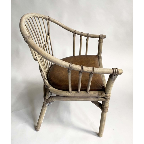 144 - ARMCHAIRS, a pair, rattan framed and cane bound with leather pads, 65cm W. (2)