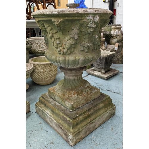 371 - ARCHITECTURAL GARDEN URNS, a pair, 86cm x 58cm diam, composite stone with swag and rams head detail.... 