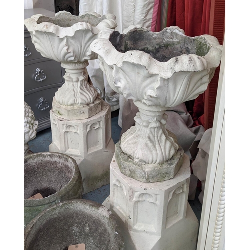 373 - ARCHITECTURAL GARDEN URNS ON STANDS, a pair, 100cm x 47cm diam, composite stone, Gothic revival styl... 