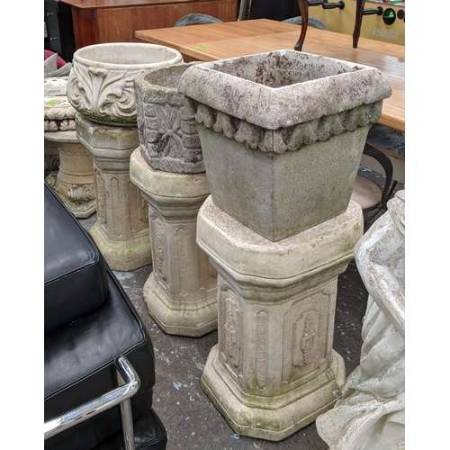 376 - ARCHITECTURAL GARDEN PEDESTALS, a set of three, 100cm at tallest, each with differing planter, compo... 