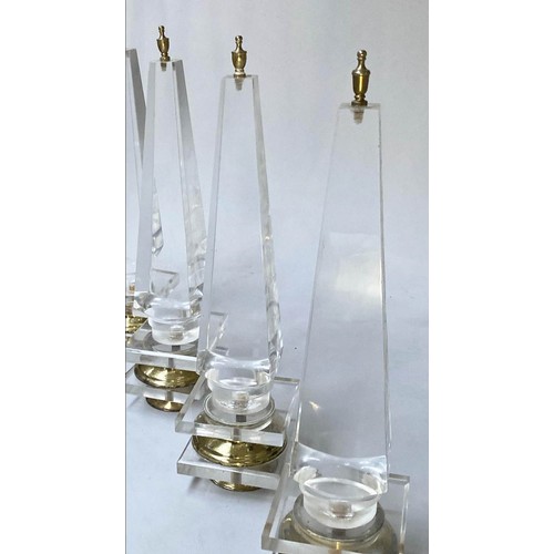 615 - TABLE OBELISKS, a set of three, 42cm H, Lucite, of tapering form on gilded bases. (3)