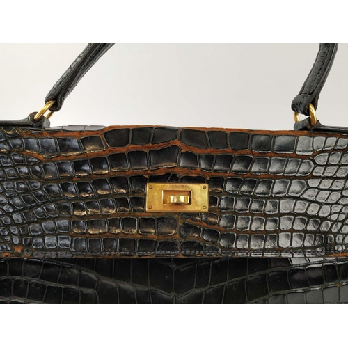 VINTAGE HERMÈS KELLY 35 NOIR SHINY CROCODILE BAG, stamped Hermès Paris 24  Fg St Honoré, gold hardwar