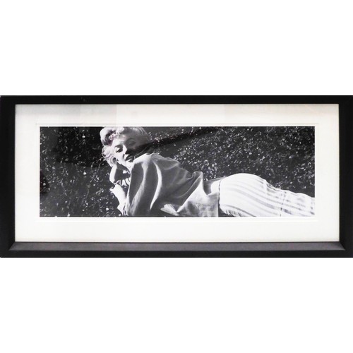 64 - MARILYN MONROE LAYING ON THE GRASS, black and white photoprint, from Trowbridge Gallery, 25cm x 85cm... 