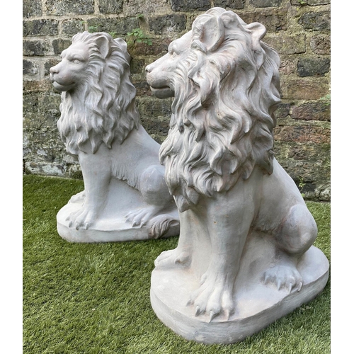 588 - GARDEN LIONS, a pair, stone effect, 63cm H. (2)