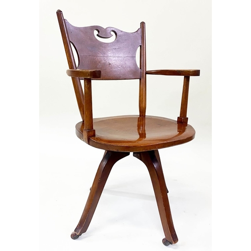 582 - OFFICE CHAIR, 1920's Art Nouveau influenced, carved oak with pierced back, shaped seat revolving on ... 