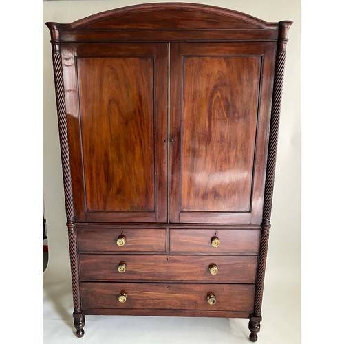 577 - LINEN PRESS, Regency mahogany, with arched cornice, spiral columns, three sliding trays, two doors a... 