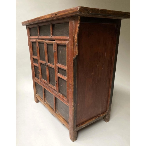 594 - CHINESE CABINET, 19th century, scarlet lacquered, with lattice front and two panelled doors, 97cm x ... 