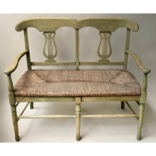 595 - HALL BENCH, vintage, green stained, with raised lyre back and rush seat, 114cm W.