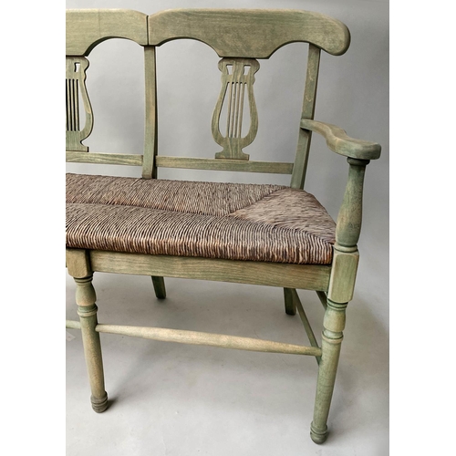 595 - HALL BENCH, vintage, green stained, with raised lyre back and rush seat, 114cm W.