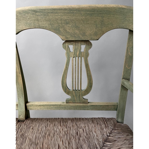 595 - HALL BENCH, vintage, green stained, with raised lyre back and rush seat, 114cm W.