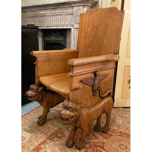 120 - THRONE CHAIR, 117cm H x 67cm W x 77cm D, Egyptian Revival teak, carved with eagles, raised on cat su... 