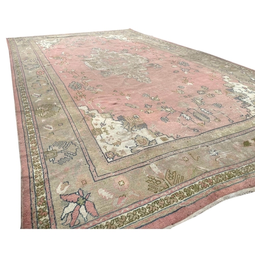 95 - ANTIQUE TURKISH CARPET, 660cm x 405cm, of country house proportions.